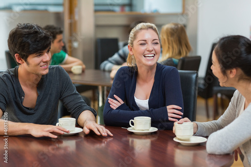 Photo: Friends enjoying coffee Friends enjoying coffee