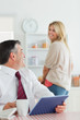 Couple smiling at each other at the kitchen before work