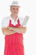 Foto: Butcher with arms crossed holding meat cleaver Butcher with arms crossed holding meat cleaver