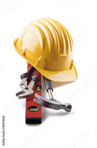 Photo: isolated hard hat with tools on white isolated hard hat with tools on white