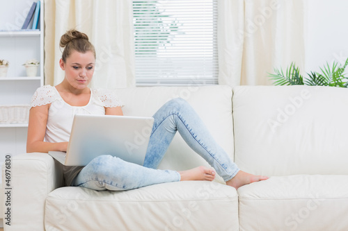 Photo: Blond woman working on laptop Blond woman working on laptop