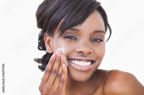 Photo: Woman using skin cream Woman using skin cream