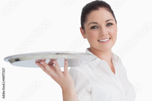 Photo: Smiling woman holding tray Smiling woman holding tray