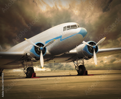 Photo: Retro passenger plane on the runway. Retro passenger plane on the runway.