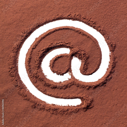 Photo: Arroba drawn on cocoa powder Arroba drawn on cocoa powder