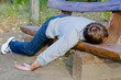 Drunk man sleeping in park