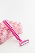 Pink razor blade with bath sponge