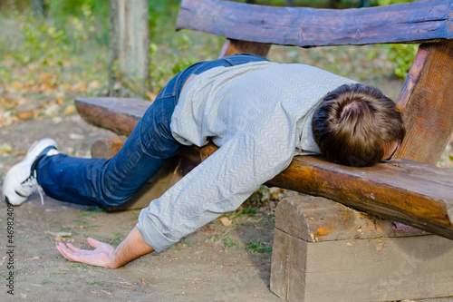 Photo: Drunk man sleeping in park Drunk man sleeping in park