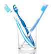 Toothbrushes in glass isolated on white