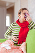 sick woman uses handkerchief