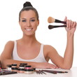 beautiful smiling girl with brushes