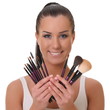 beautiful smiling girl with brushes