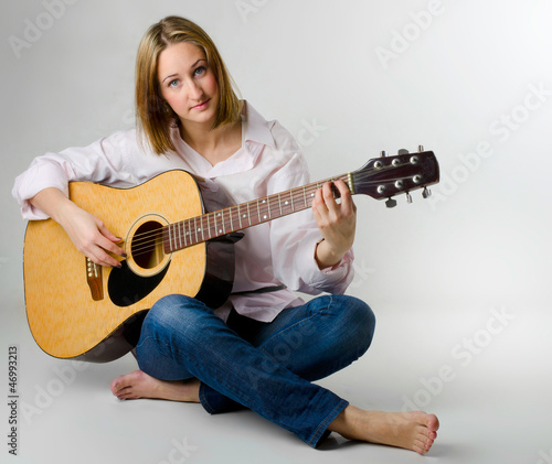 Photo: young woman with guitar young woman with guitar