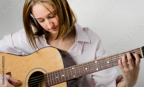Photo: young woman with guitar young woman with guitar