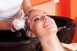 Beautiful young girl enjoying hair washing