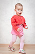 Full length portrait of a happy little girl
