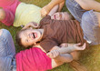 canvas print picture - Portrait of childrens posing on grass and smiling