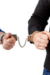 Men and women connected with handcuffs