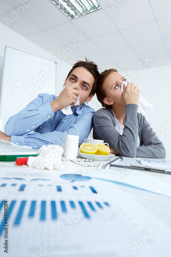 Photo: Ill office workers Ill office workers
