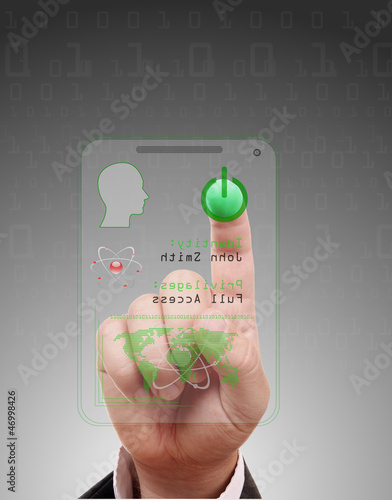 Photo: Man entering the door or secure data by touch screen Man entering the door or secure data by touch screen