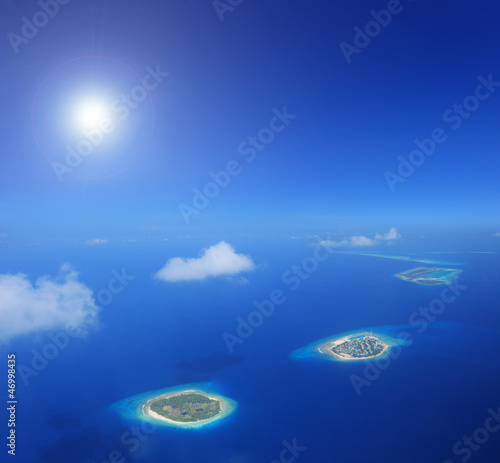 Photo: Sun and clouds over islands in Laccadives sea, Maldives Sun and clouds over islands in Laccadives sea, Maldives