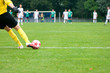 soccer player kick the ball