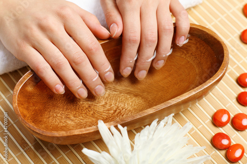 Photo: Woman is getting manicure Woman is getting manicure