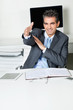 Businessman Offering Handshake In Office