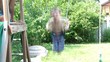 Boy Swinging on Swing in Backyard