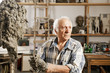 Sculptor kneads clay