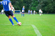 soccer player kicks the ball. Horizontal image of soccer ball wi