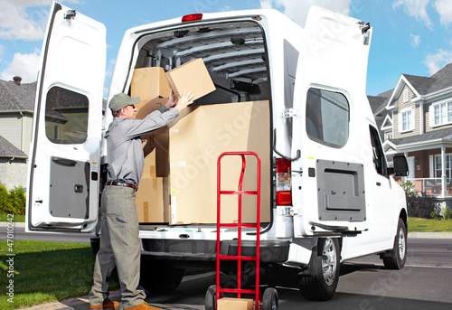 Photo: Delivery postal service man. Delivery postal service man.