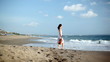 Video: Young woman standing at coast and playing on violin Young woman standing at coast and playing on violin