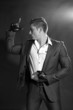 Businessman making a gun gesture