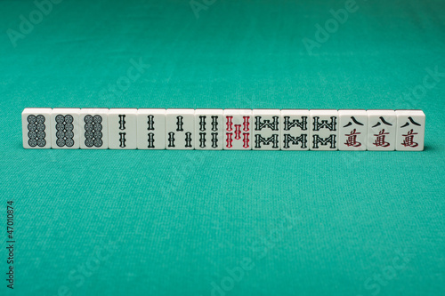 Photo: Smooth table surface with a mahjong on it Smooth table surface with a mahjong on it