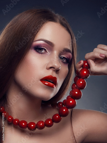 Photo: Portrait of beautiful woman model with professional makeup Portrait of beautiful woman model with professional makeup