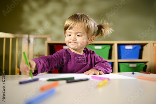 Photo: Babies and fun, child drawing at school Babies and fun, child drawing at school