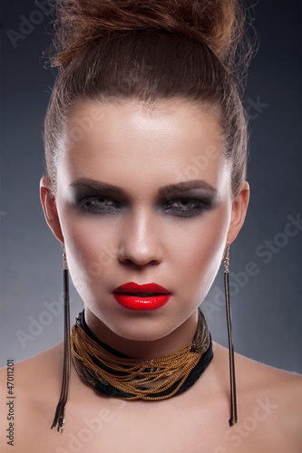 Photo: Portrait of beautiful woman model with professional makeup Portrait of beautiful woman model with professional makeup