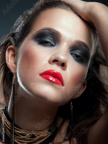 Photo: Portrait of beautiful woman model with professional makeup Portrait of beautiful woman model with professional makeup