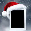 Foto: Voucher on tablet pc for christmas with mitre Voucher on tablet pc for christmas with mitre