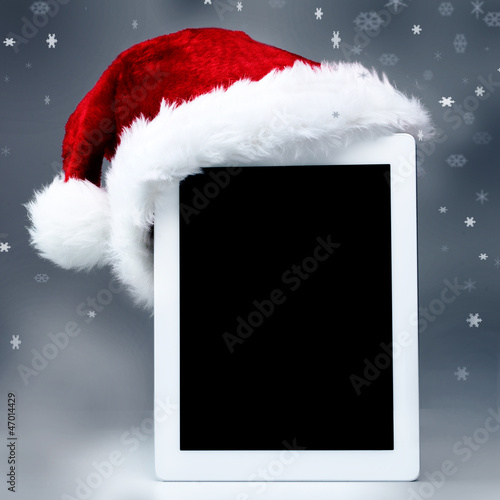 Photo: Voucher on tablet pc for christmas with mitre Voucher on tablet pc for christmas with mitre