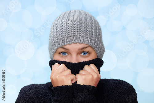 Photo: Young woman with pullover and cap in winter Young woman with pullover and cap in winter