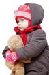 Baby in winter clothes on a white background