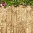 Christmas fir twig with red berries on the wooden background