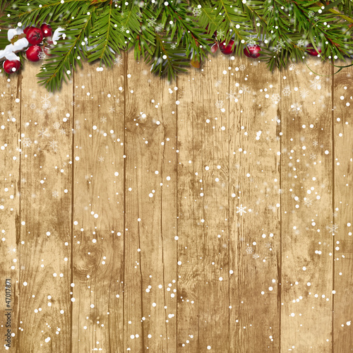 Illustration: Christmas fir twig with red berries on the wooden background Christmas fir twig with red berries on the wooden background