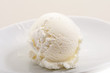 Photo: ice cream scoop on white plate close-up ice cream scoop on white plate close-up