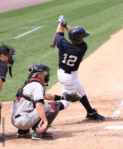 Photo: baeball batter swinging baeball batter swinging