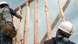 Construction Workers Hammering Frame