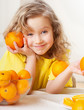 Child with oranges