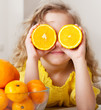 Child with oranges